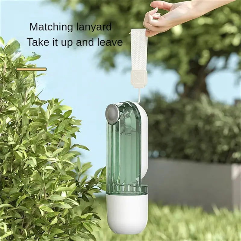 A sleek translucent green and white portable pet water cup with a matching lanyard designed for dog walking in the water cup segment.