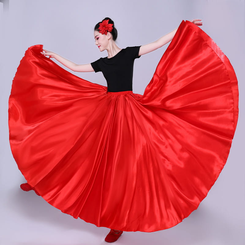 vibrant red satin dance skirt with a flowing pleated design and matching floral hair accessory showcasing a simple solid color performance skirt style