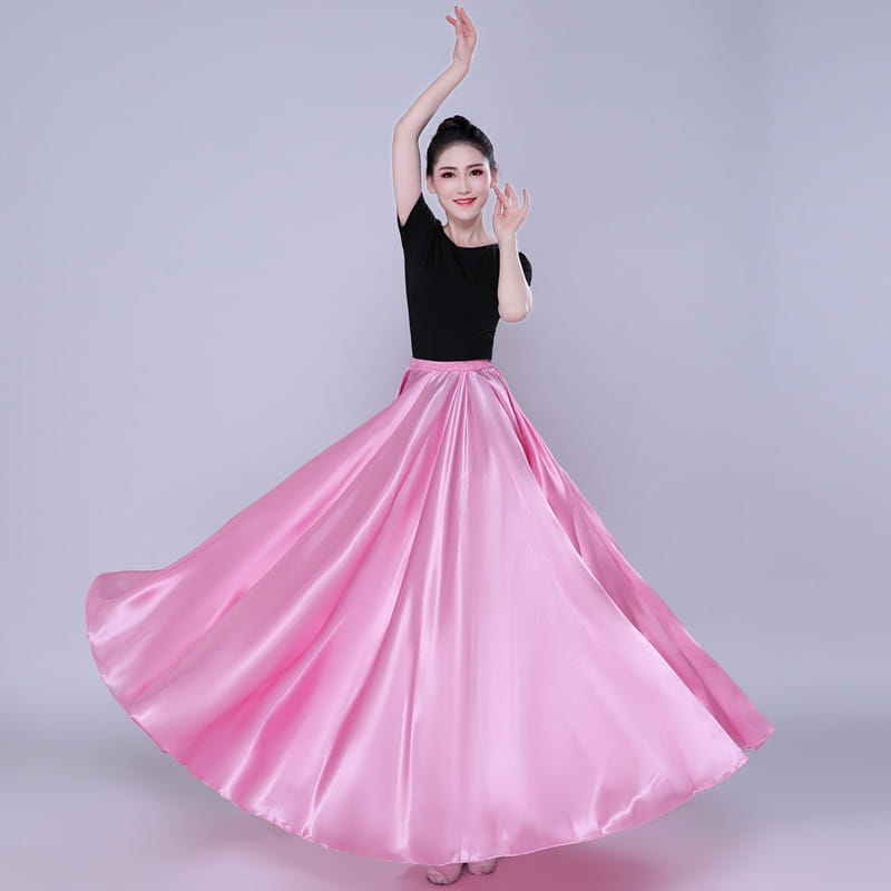 a flowing pink satin dance skirt with a high waist and full elegant flare designed as a simple solid color performance color performance skirt