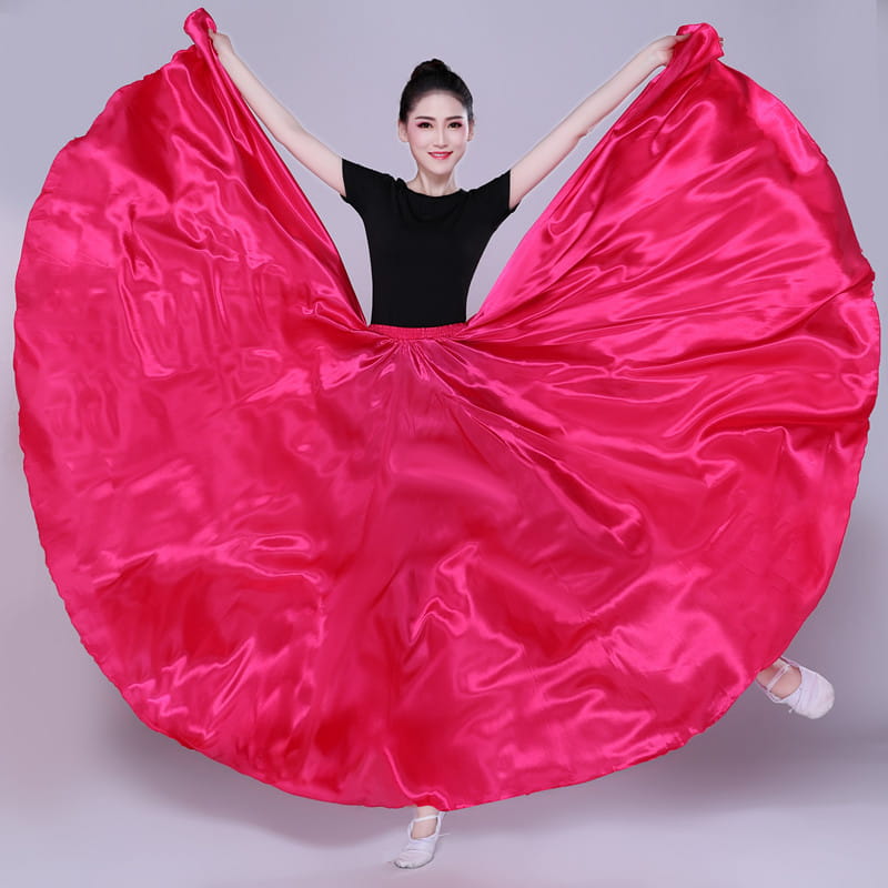 Vibrant fuchsia satin simple solid color performance skirt with a flowing circular design.