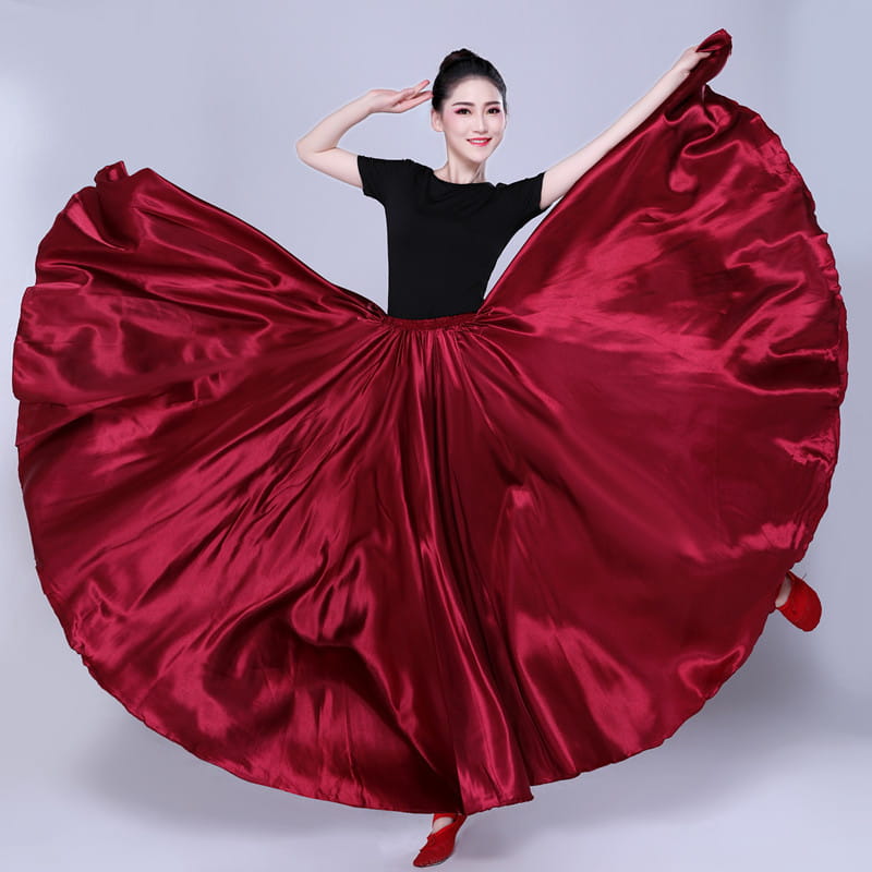 a flowing deep red satin dance skirt with a high waisted design and full billowing silhouette suitable as a solid color performance skirt