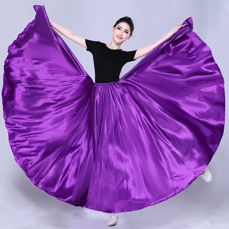 Vibrant purple satin solid color performance skirt with a flowing wide hem and elastic waistband designed as a simple solid color dance skirt.
