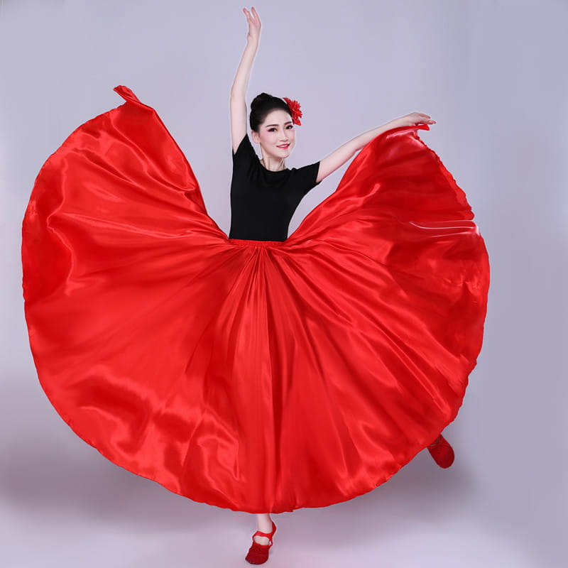 a vibrant red satin solid color performance skirt with a flowing wide hem and gathered waistband designed for color performance use