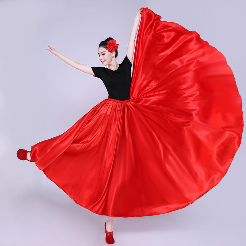 Vibrant red satin solid color performance skirt with a flowing full silhouette and matching floral hair accessory ideal for dance and color performance skirt events.