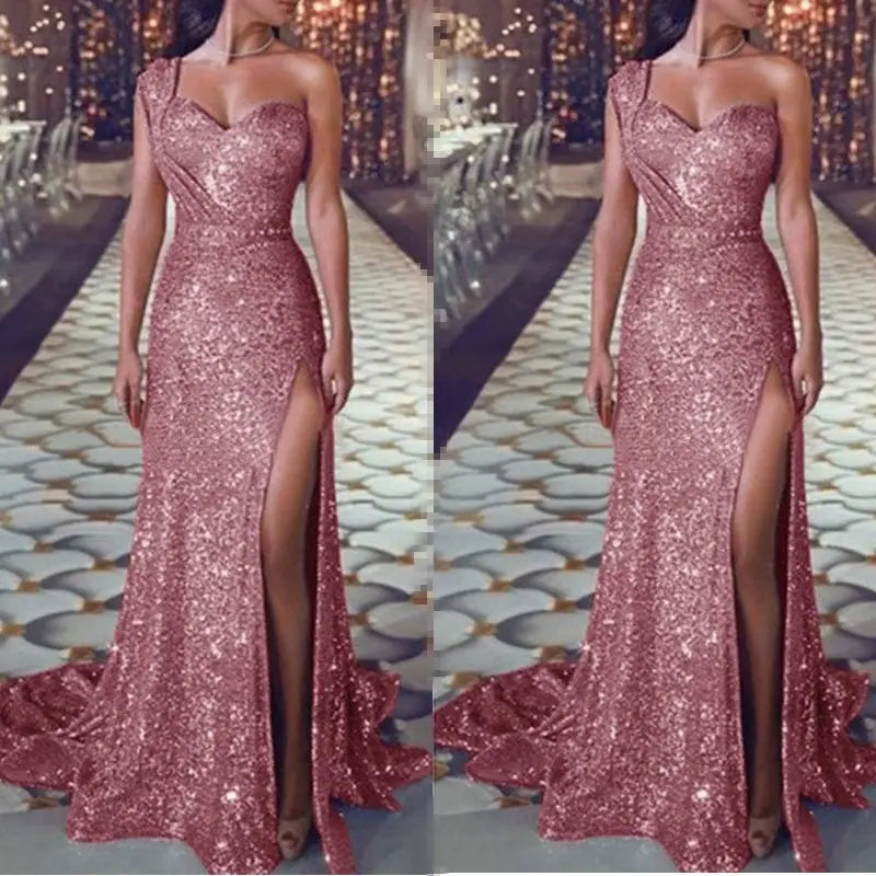 A shimmering rose gold sleeveless bronzing split dress featuring a one-shoulder design and high slit.
