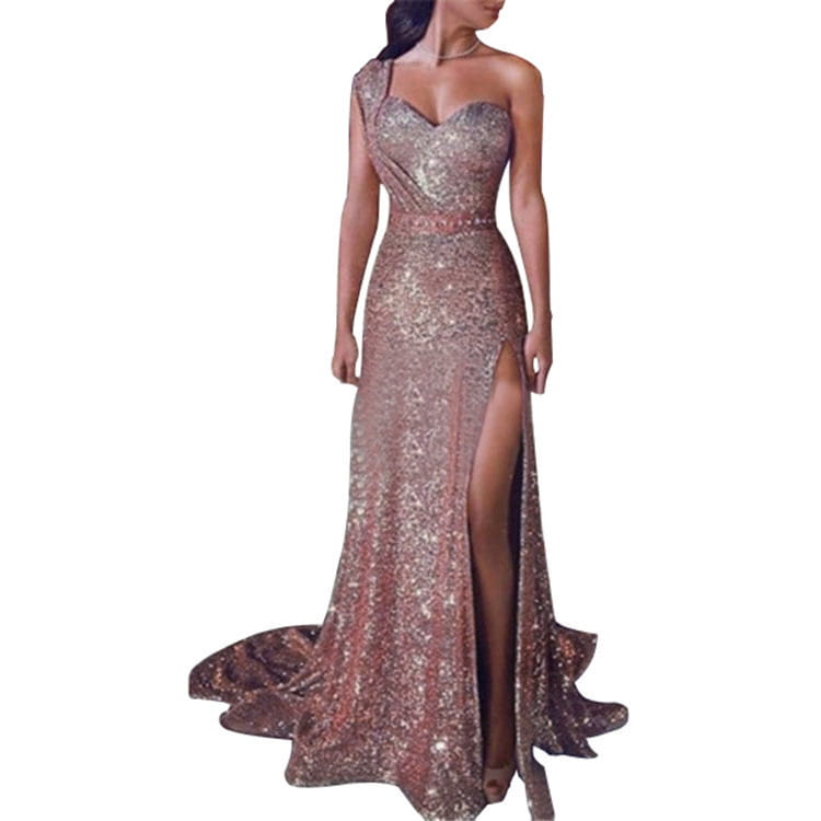 a sleeveless bronzing split dress featuring a shimmering rose gold sequined fabric with a one shoulder design, high slit, and fitted silhouette.