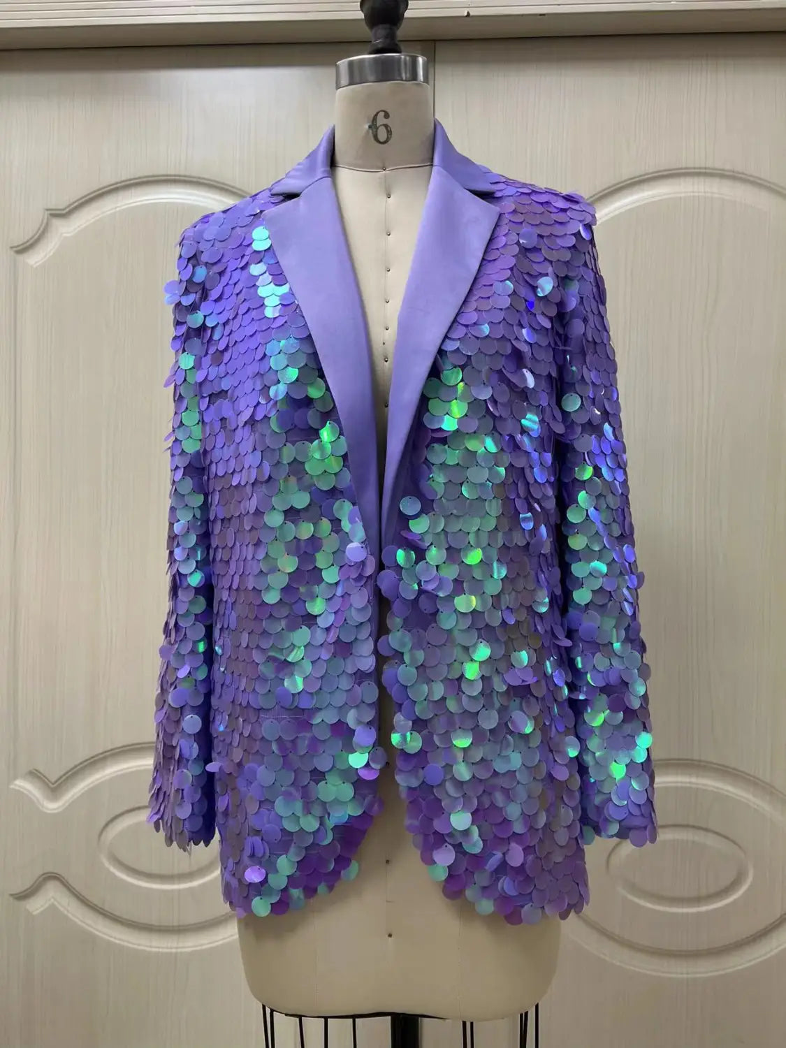 a lavender sequin fashion suit blazer featuring shimmering loose sequins with iridescent green and blue accents and a sleek satin lapel ideal for a high dinner party