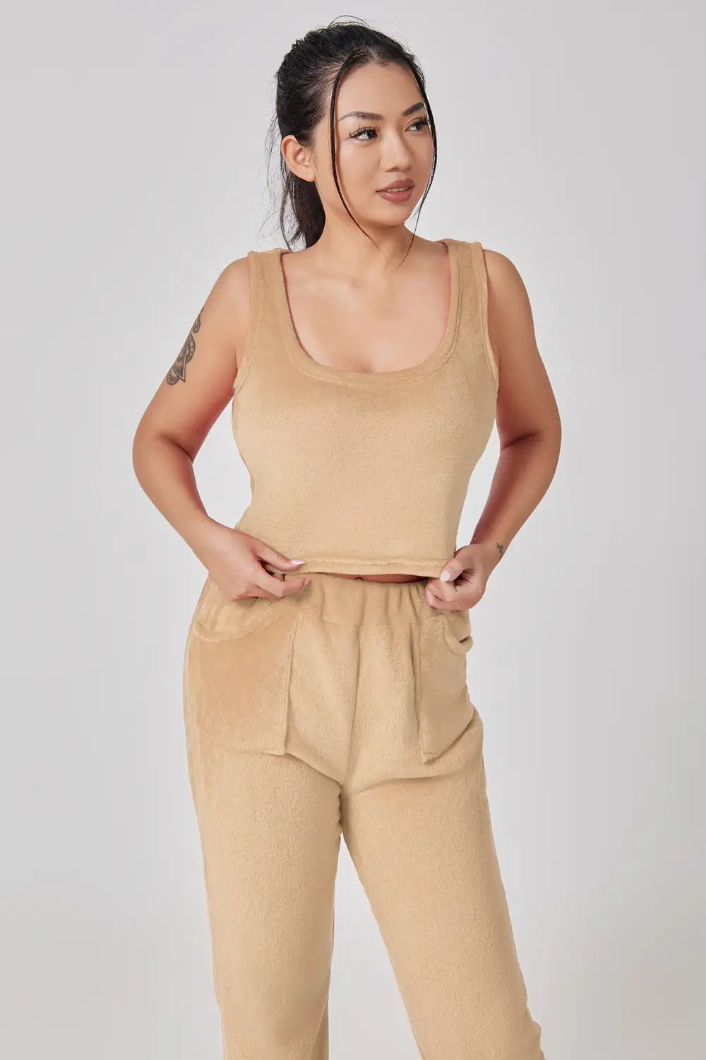 beige ribbed tank top with a square neckline and matching high-waisted pants as part of a cozy piece lounge set ideal for casual comfort and relaxation
