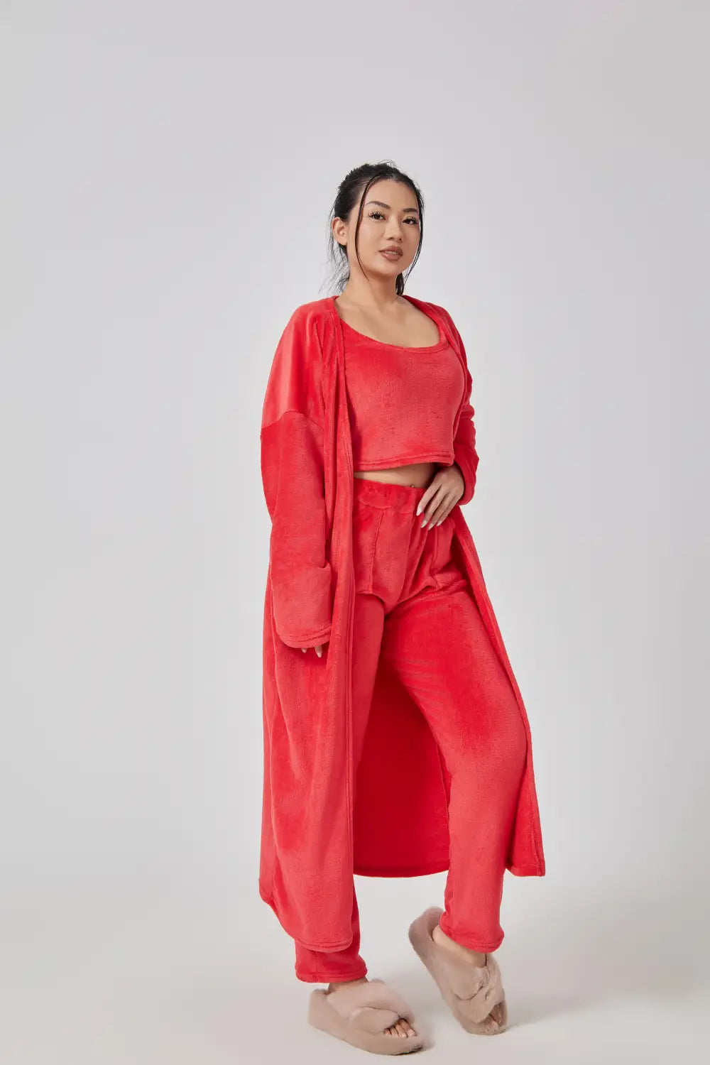 Red velvet three-piece cozy pajama set featuring a cropped top, high-waisted pants, and an open long robe as part of the Blue Shimmer lounge set.