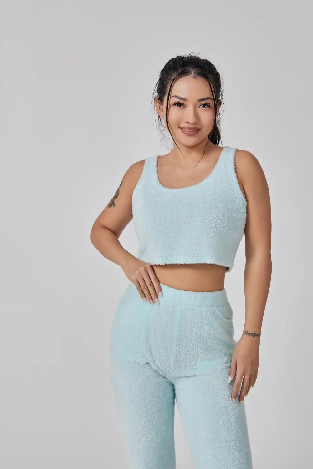 Light blue fuzzy cozy pajama set featuring a soft fabric three piece lounge set ideal for comfortable indoor wear.