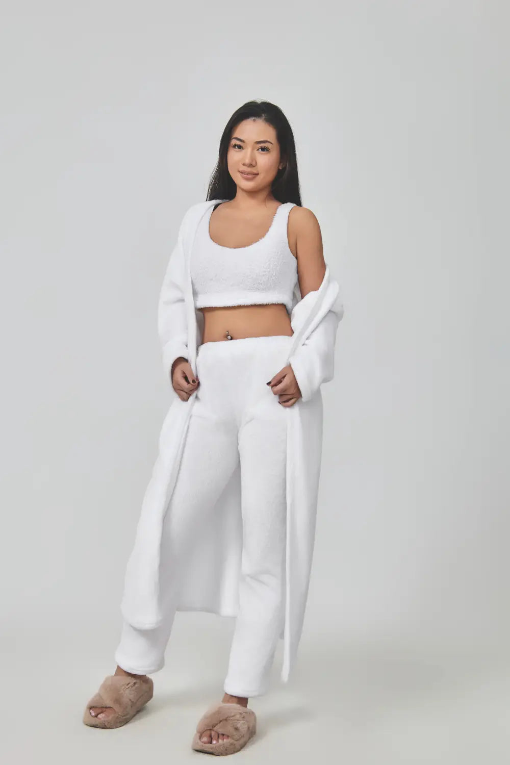 White knit crop top with soft textured fabric and open front design featured in a blue shimmer 3 piece lounge set for a cozy pajama set.