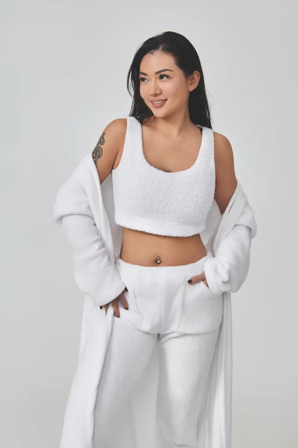 White fuzzy crop top with a square neckline and soft textured fabric as part of the blue shimmer 3 piece lounge set ideal for a cozy pajama set.