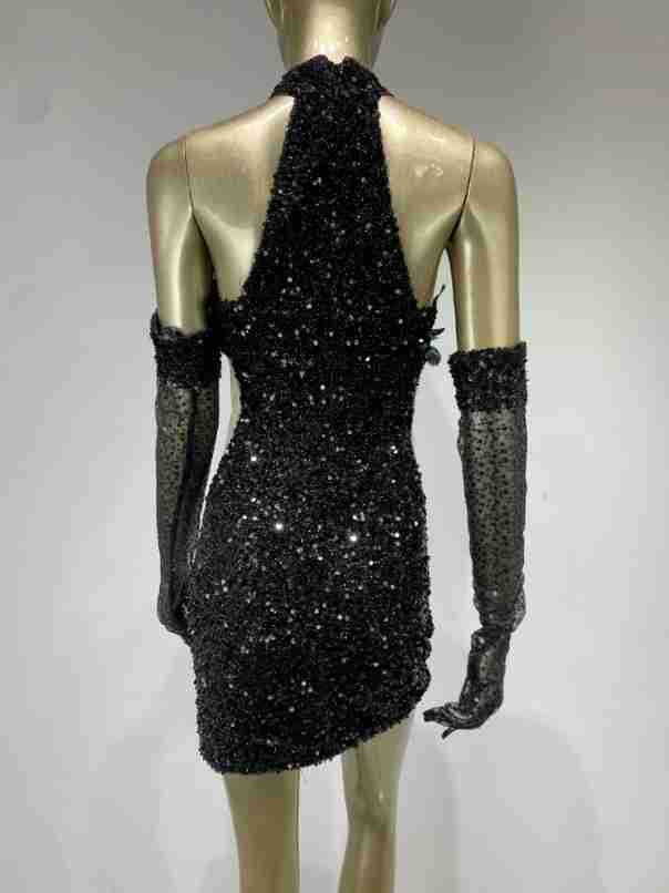 black halter feather sequins short mini dress with long sheer gloves featuring black sequined halter design and feather sequins detailing.