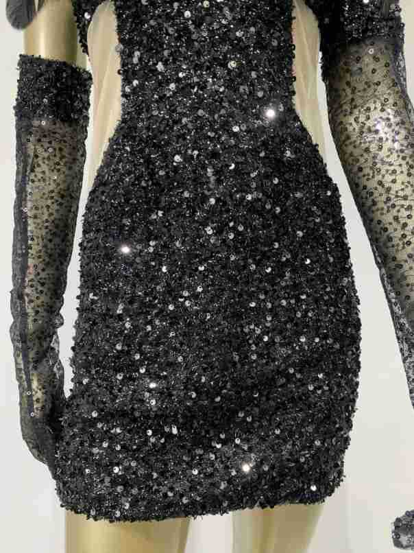 black halter feather sequins short mini dress featuring black sequined fabric with sheer long sleeves for an elegant evening look