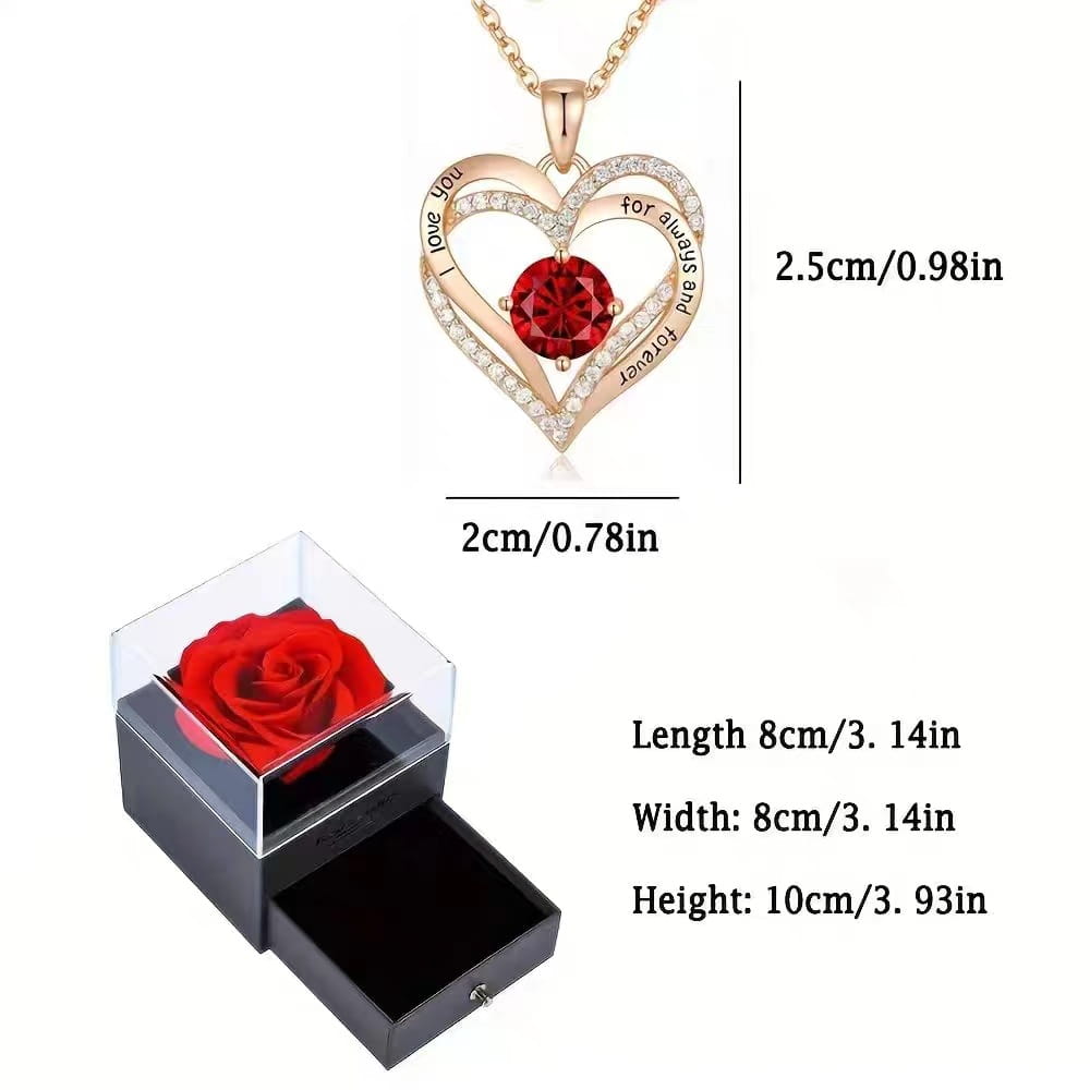 Rose gold heart-shaped sapphire pendant necklace with a central red sapphire gemstone and surrounding diamonds engraved with i love you for always and forever displayed with a black gift box containing a preserved red rose.