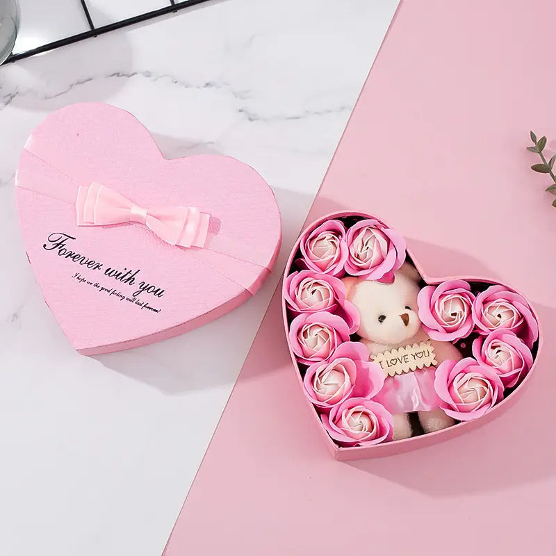 rose red heart gift box for mother’s day containing pink soap roses and a small teddy bear with an i love you tag.