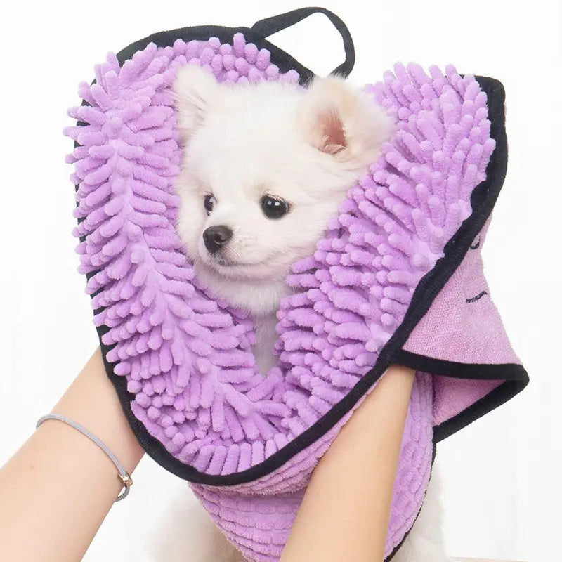 A lavender super absorbent microfiber bath towel for dogs cats with black trim designed as a pet drying hood to gently wrap around a dog’s neck for quick and comfortable drying.