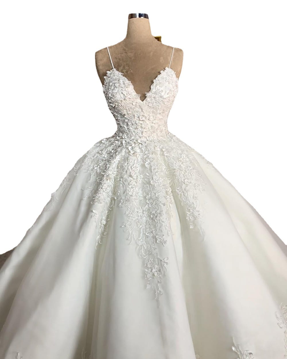 A white lace wedding dress romantic aura with a deep v-neck, fitted bodice, voluminous skirt, and delicate floral embroidery along the neckline and front.