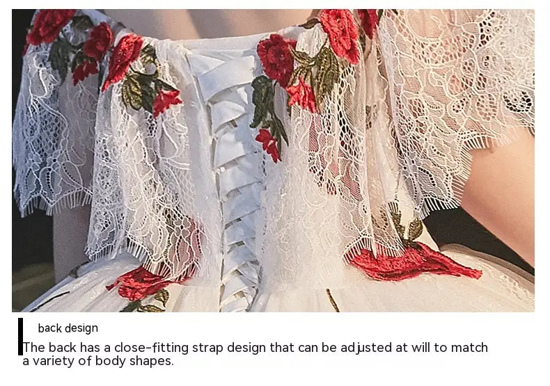 white lace wedding dress with red rose embroidery and a corset-style temperament bride bra trailing back strap design