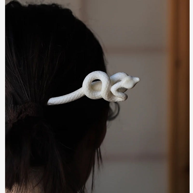 white ceramic snake hair clip with smooth glossy finish and detailed coiled design featuring a retro style hairpin appearance.