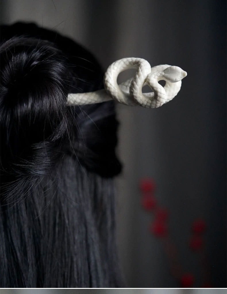 white ceramic snake hairpin with coiled design and smooth glossy finish in retro style hairpin for elegant styling