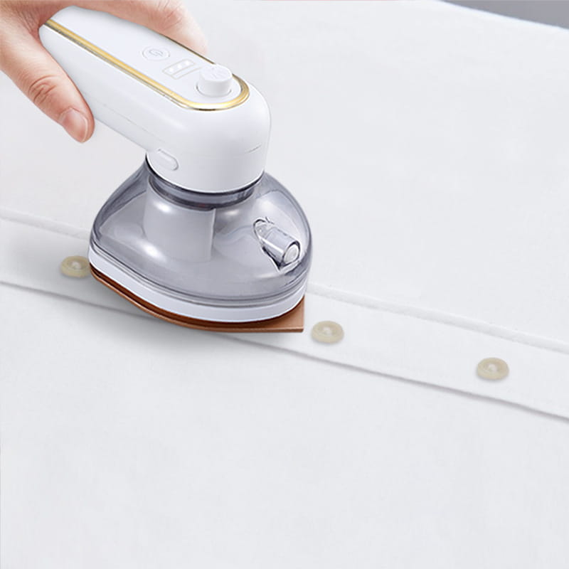 White and gold rechargeable portable iron with steam feature in a white and transparent handheld garment steamer design.