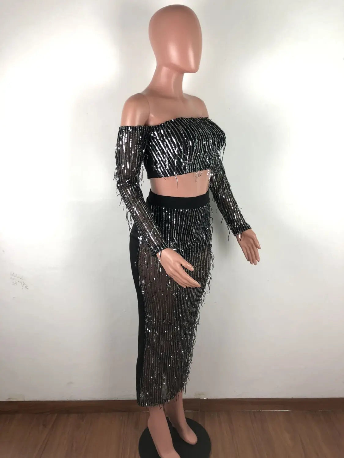 shimmering black mesh sequins tassel two piece set featuring an off-the-shoulder crop top with long sleeves and fringe detailing in a fashion sexy design.