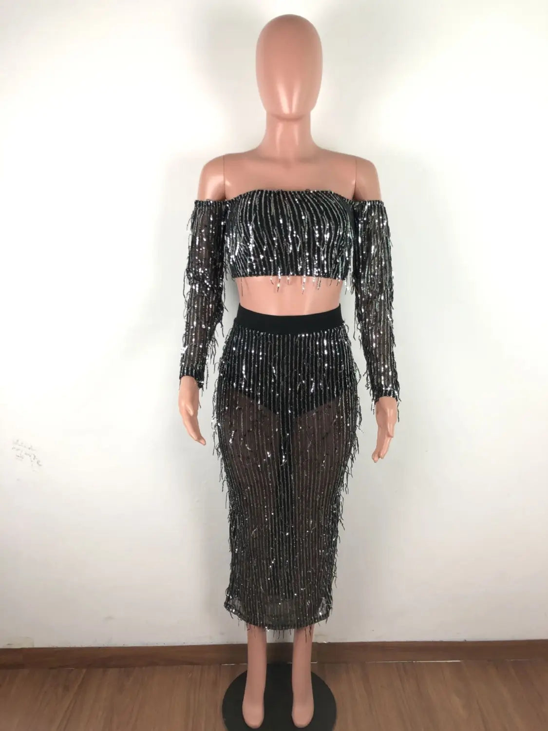 black mesh sequins tassel two piece set featuring a shimmering black sequined off-shoulder crop top with long sleeves and fringe detailing showcasing fashion sexy mesh sequins design.