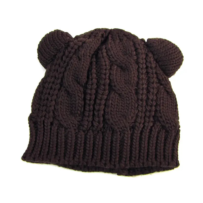 dark brown knitted beanie made 3d cute with a cable knit pattern and two rounded knitted cat ear-like protrusions on top