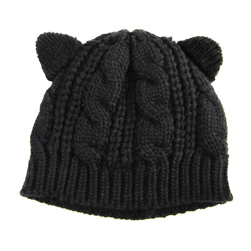 Black textured cute knitted cat ear beanie in black featuring a cable pattern with soft, rounded made 3d cute knitted cat ear accents.