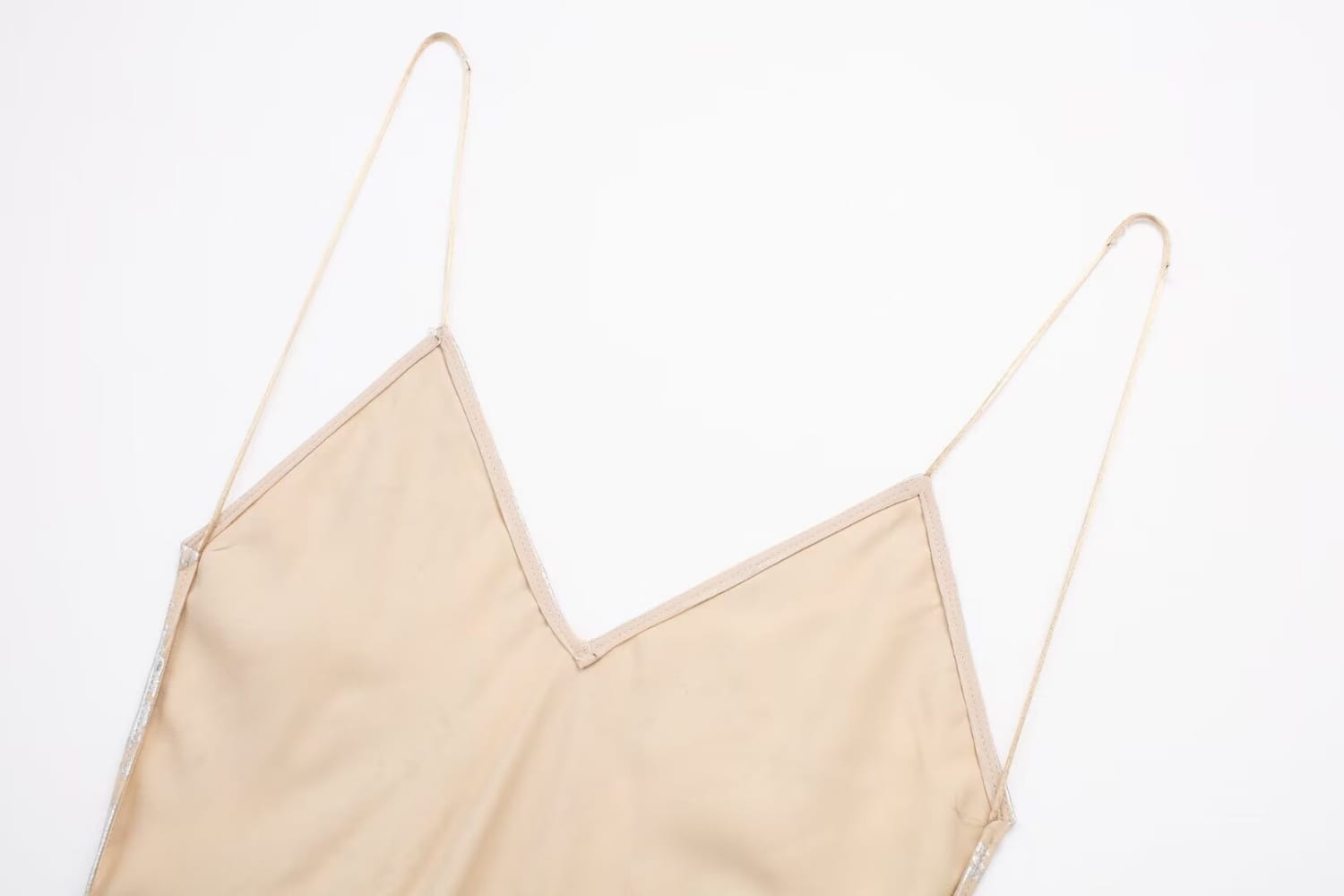 Beige satin camisole with thin spaghetti straps and a v-neckline featured in a silver satin metal foil printed underwear dress.