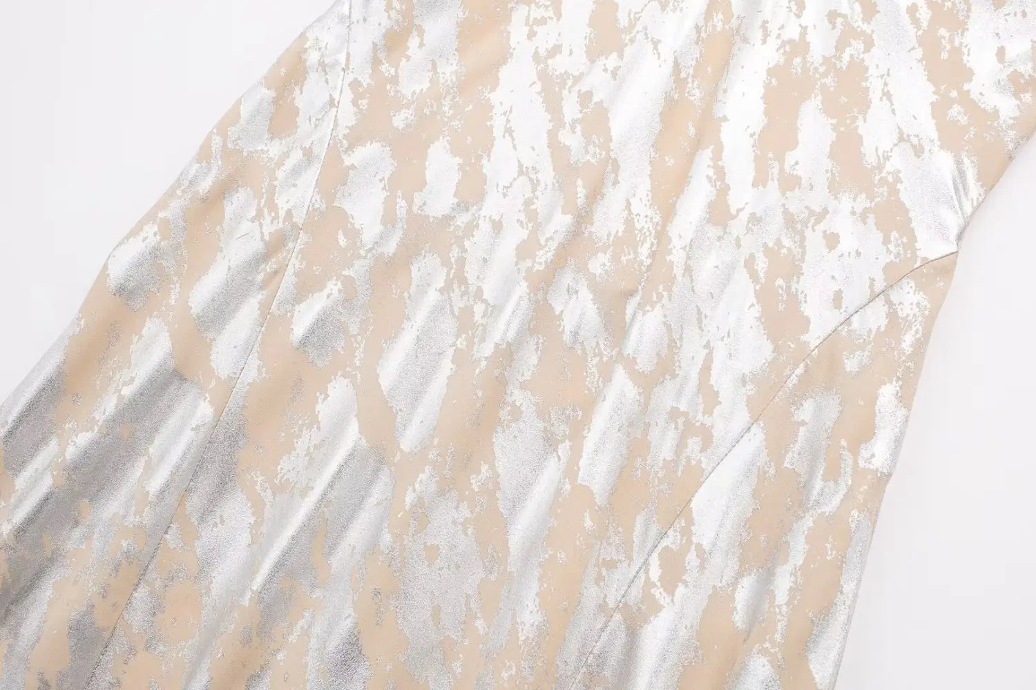 a shimmering metallic foil printed underwear dress in silver and beige satin with a mottled pattern