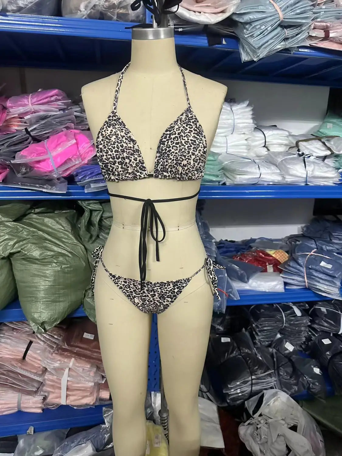 leopard print breathable strap bikini swimsuit featuring a leopard-print bikini set with black ties and adjustable side strings for a customizable fit.