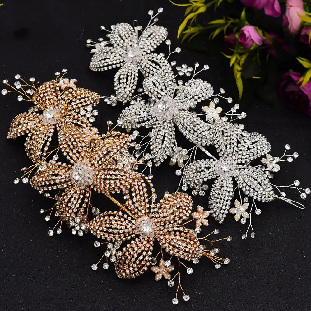 Elegant silver flower rhinestone hair accessories featuring delicate wirework with sparkling rhinestones and tiny pearl accents for weddings.