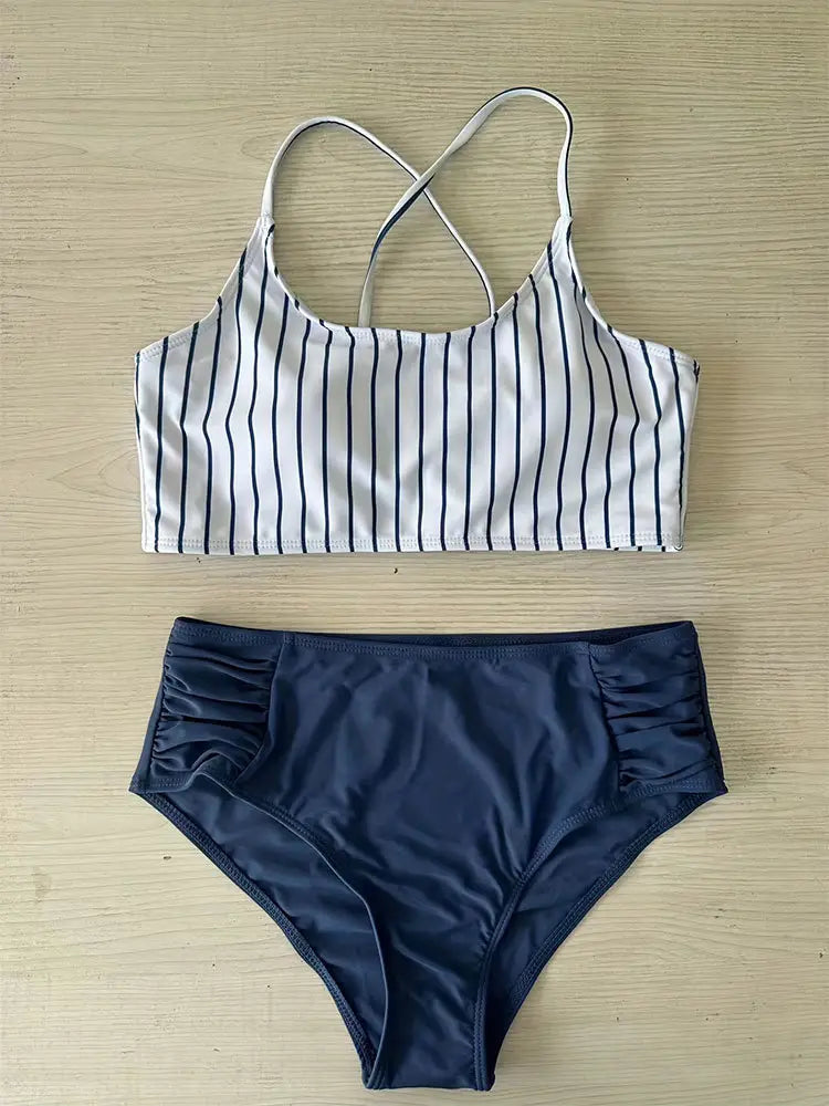 white and navy blue striped bikini split swimsuit for women featuring a crop top with crisscross back straps