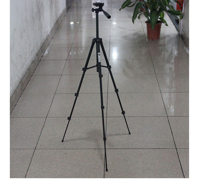Black portable tripod universal digital camera bracket with adjustable legs and camera mount for versatile use.