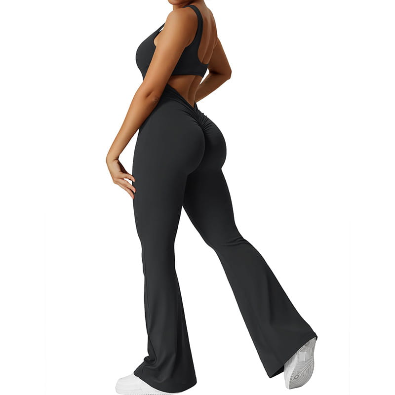 black high-waisted flared leggings with a ruched back seam shown from the back as part of a black flared slim fit hip raise jumpsuit.