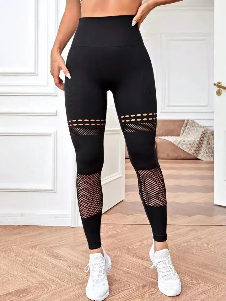black high-waisted hollow seamless yoga pants with mesh panels on the thighs and lower legs designed for yoga pants training