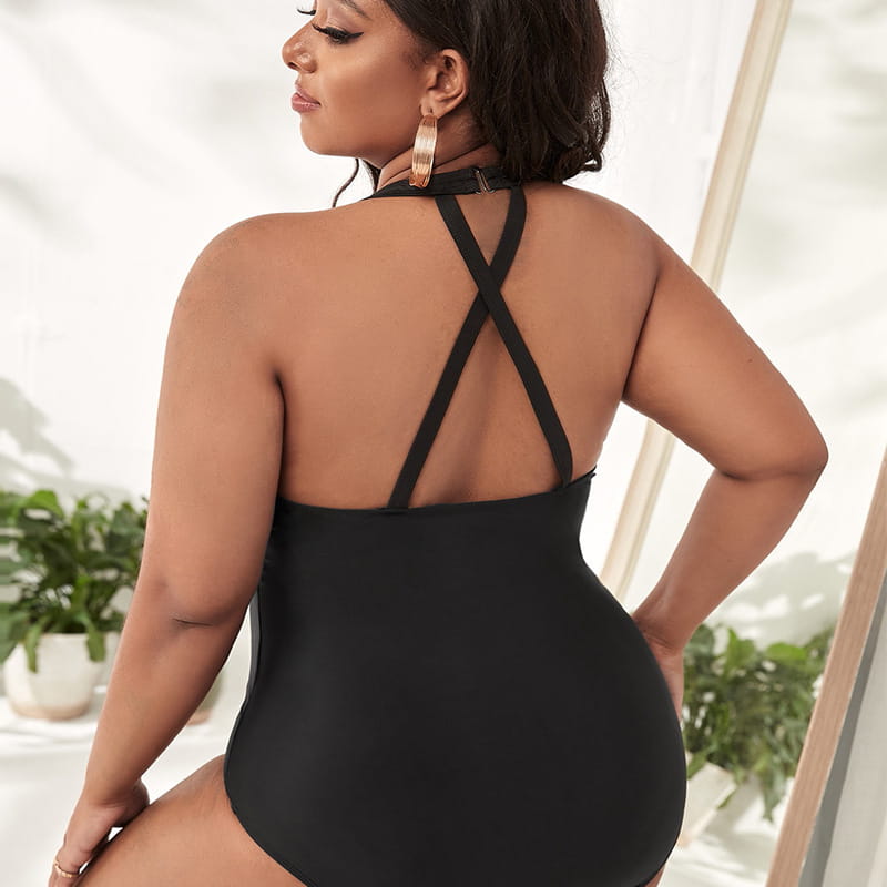 black one-piece swimsuit with a crisscross back design shown from the back in a plus size leopard print mesh one-piece swimsuit style.