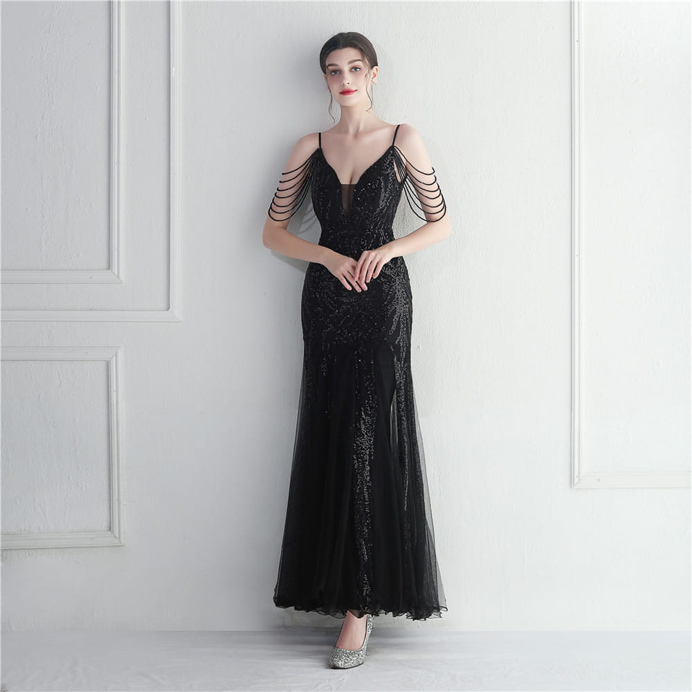 A black mesh beaded bridal mermaid gown featuring a sheer overlay and delicate shoulder straps suitable for bridal wedding dinner events.