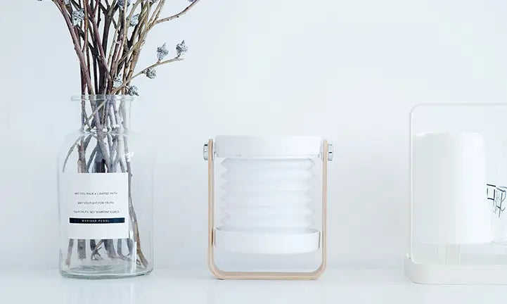 white collapsible lantern with light wood frame featuring foldable touch dimmable night light functionality for touch dimmable reading use