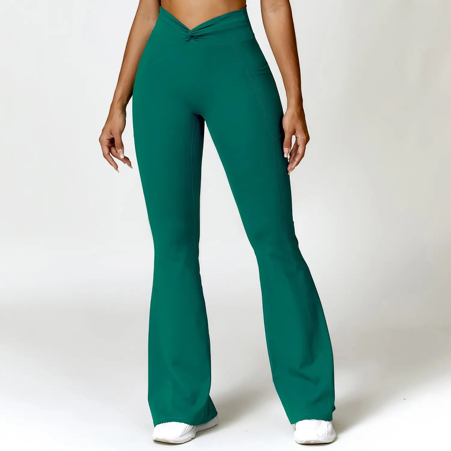 emerald green american hip raise high waist yoga pants featuring a front tie detail and flared fit designed for comfortable activewear use
