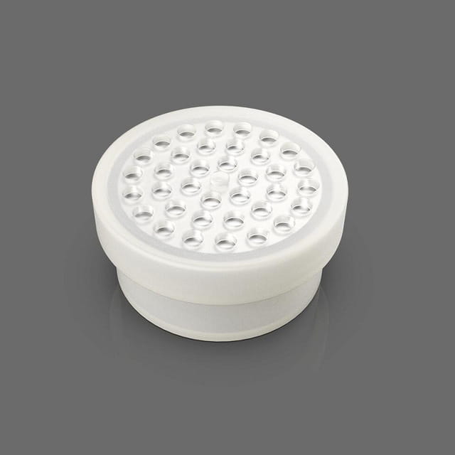 white circular led light fixture with a grid of small evenly spaced holes on its top surface for the george dinosaur mosquito lamp designed as a dinosaur mosquito lamp.