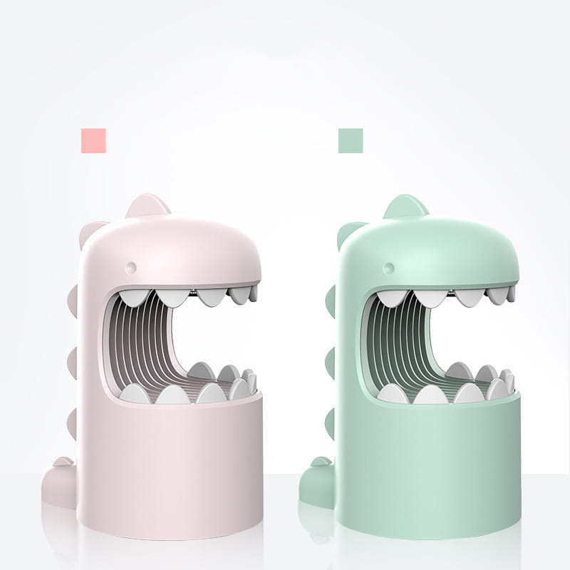 pastel pink and mint green george dinosaur mosquito desk organizers with smooth plastic bodies and white tooth-like ridges along their open mouths featured as a dinosaur mosquito lamp.