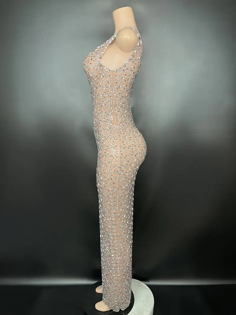 A shimmering silver metallic niche princess gathering banquet dress featuring a form-fitting one-shoulder design adorned with intricate silver sequins and crystals.