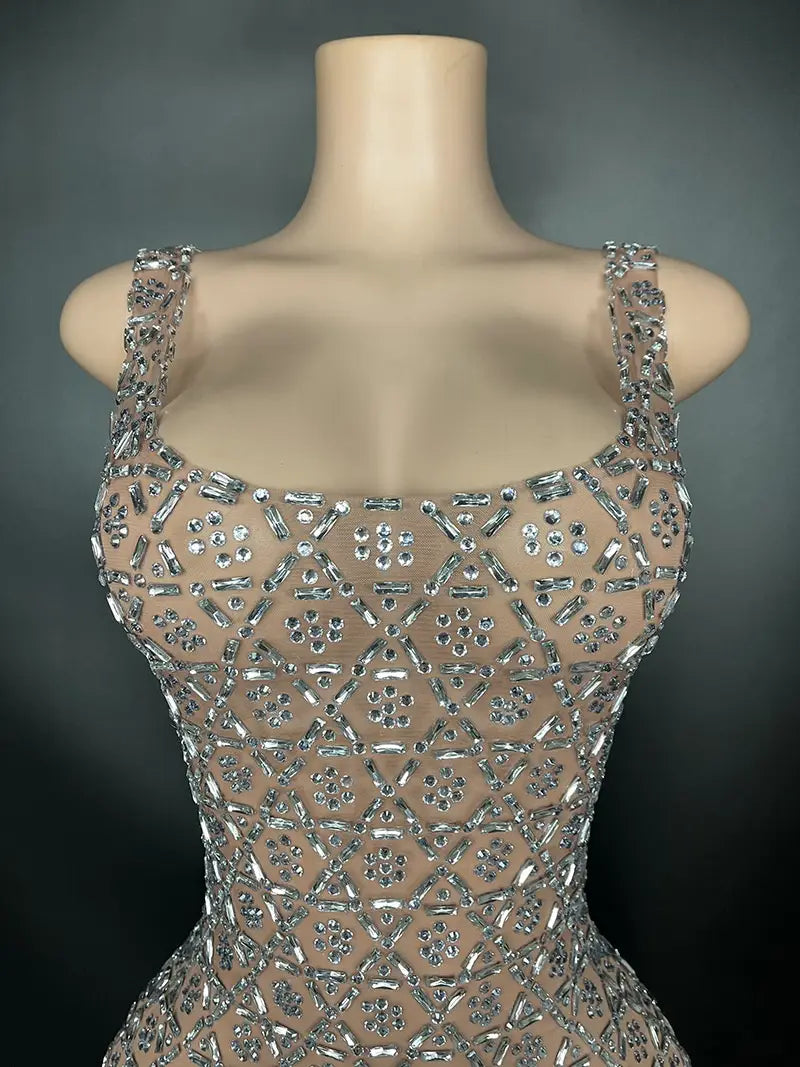 A shimmering silver metallic niche princess gathering banquet dress featuring a sheer mesh overlay with intricate geometric beadwork.