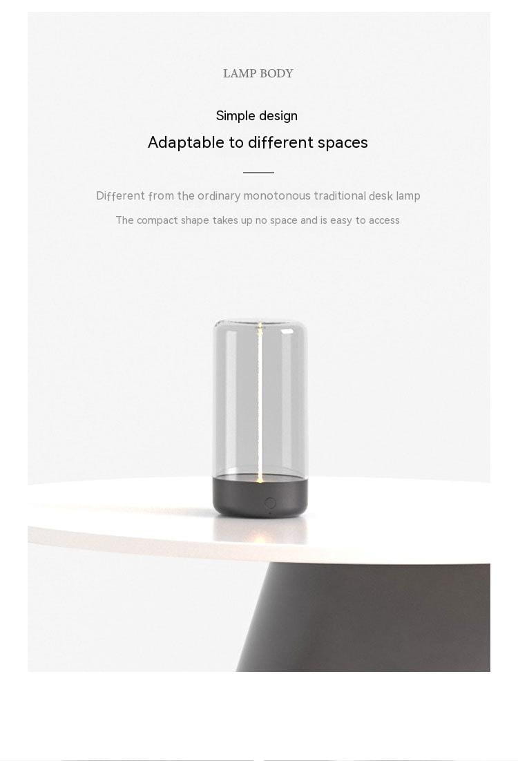 Transparent cylindrical led camping light with a sleek black base featuring a minimalist design and rechargeable portable night light functionality for convenient use.