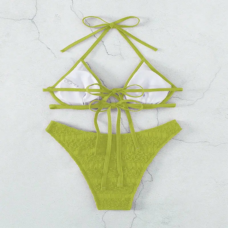 Lime green lace bikini split swimsuit with white triangular cups and matching ties in a two piece design.