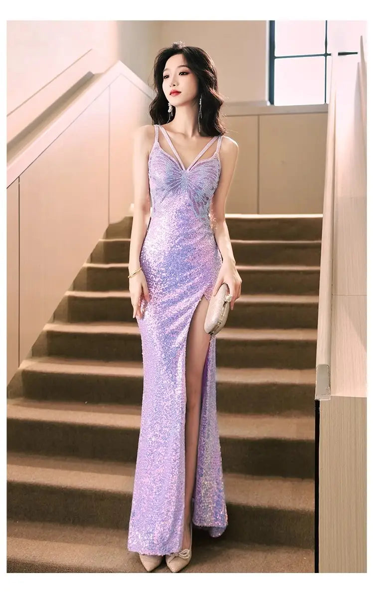 A shimmering lavender sequined evening dress with a plunging v-neckline and high slit ideal for formal wear events.