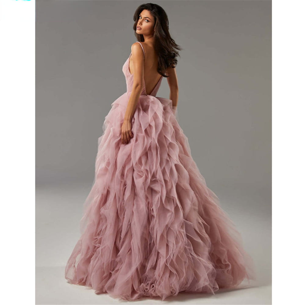 a blush pink mesh long dress evening gown prom with flowing tulle fabric, layered ruffled skirt, and delicate spaghetti straps.